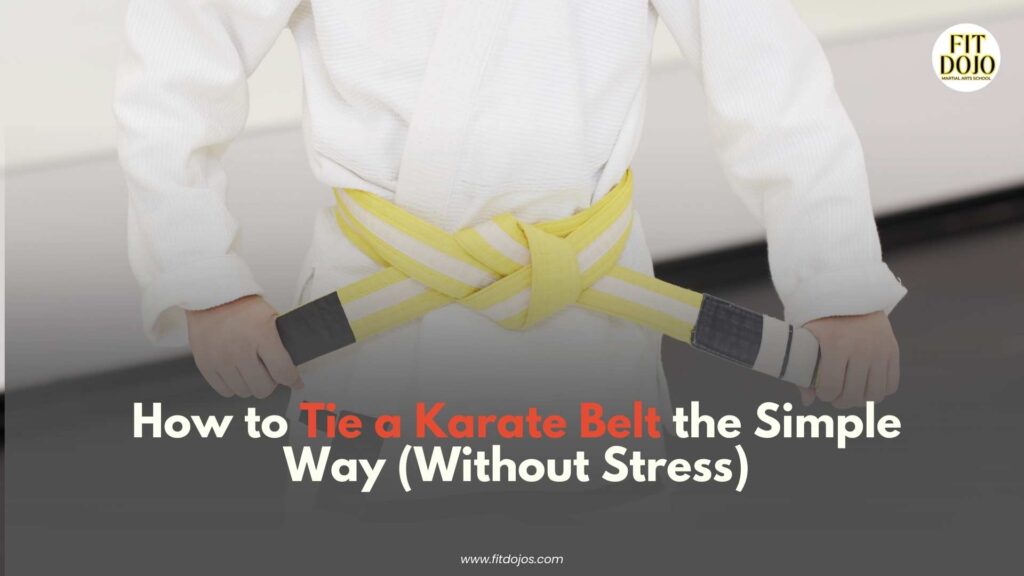 Close-up image of hands tying the knot to show How To Tie A Karate Belt simply and clearly.
